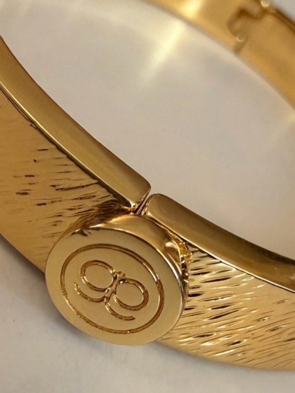Gorjana Gold Textured Hinge Bangle with Signature Round Emblem